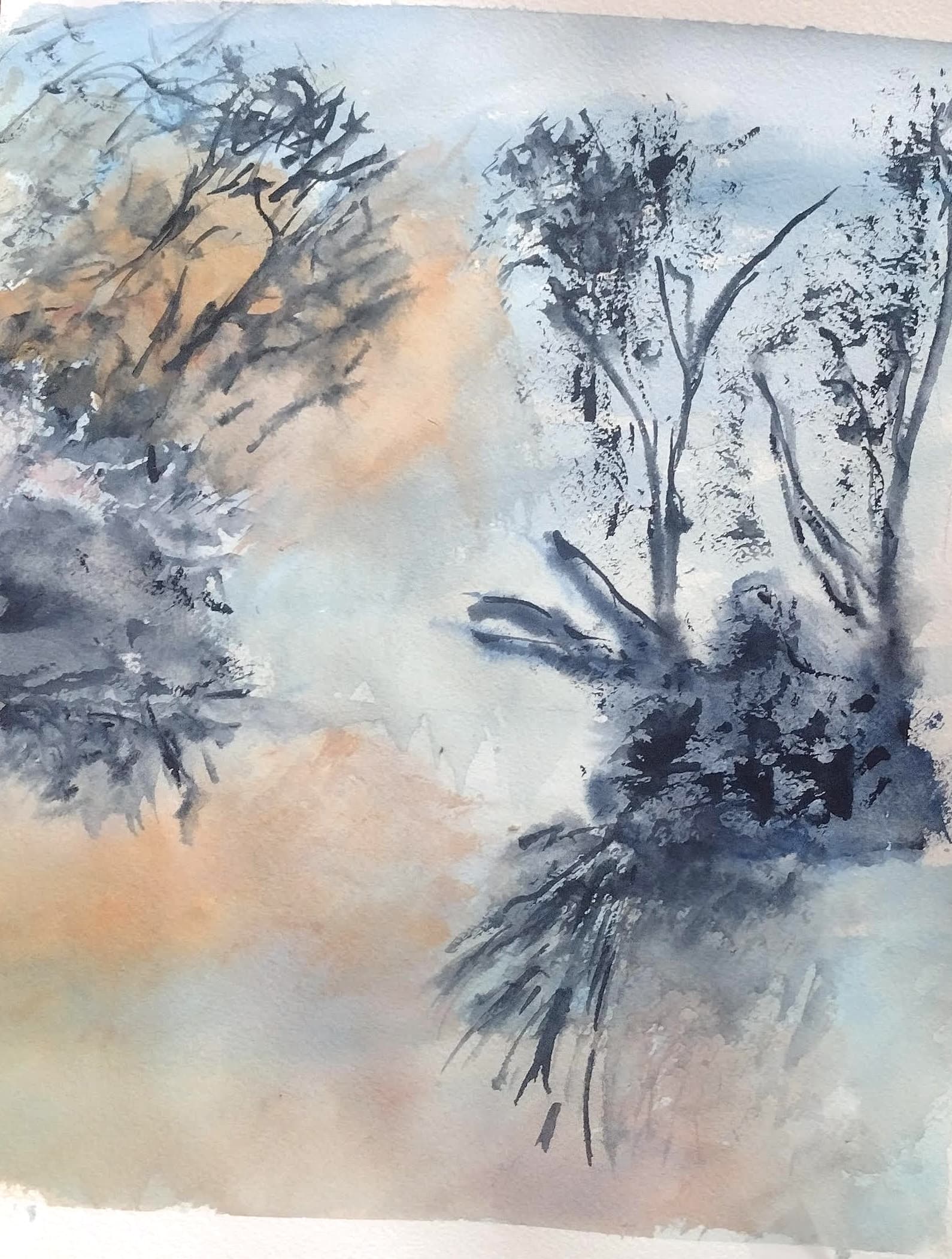 Abstract watercolor painting featuring dark, spindly trees against a misty blue and orange background.